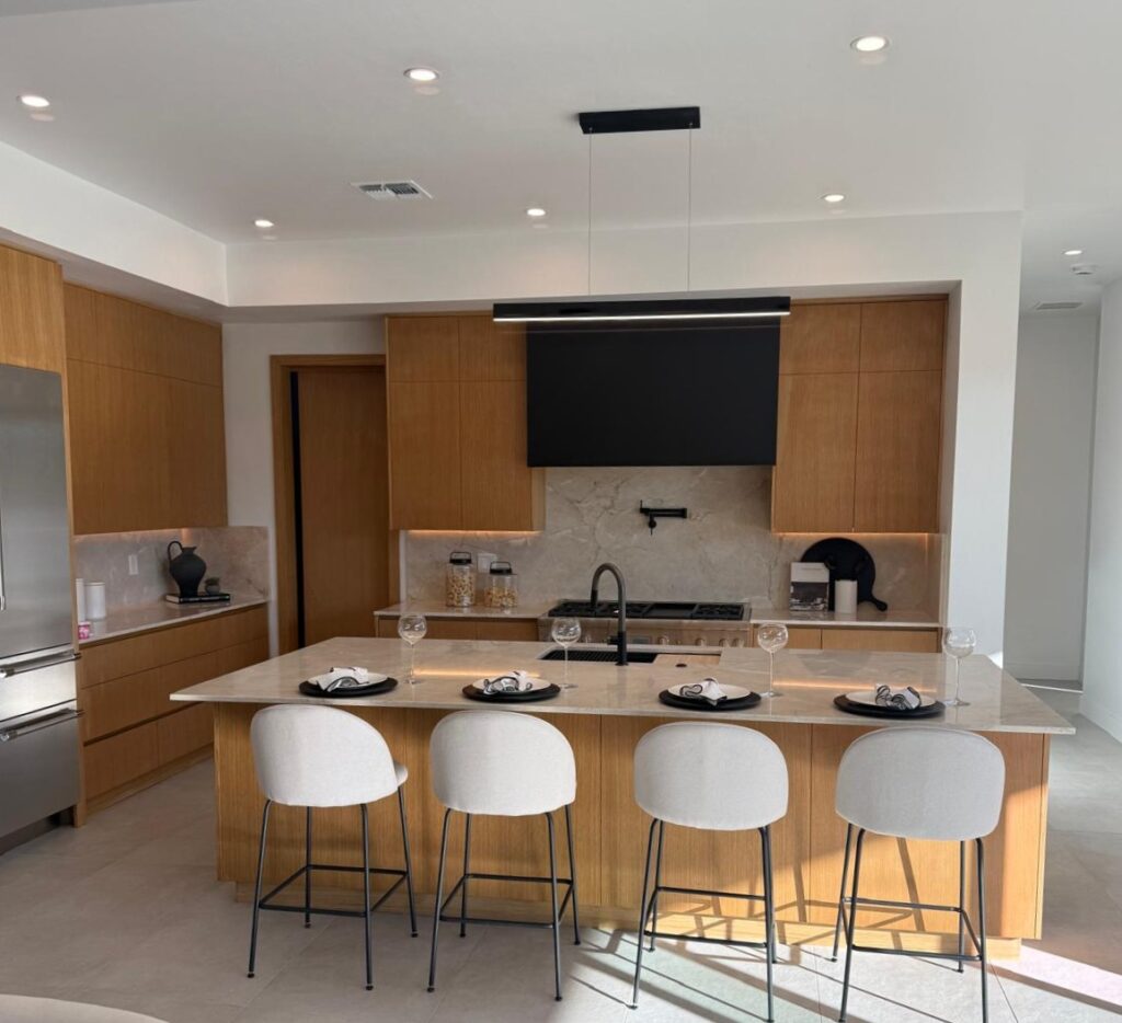 Custom white oak kitchen cabinets and integrated kitchen island by Alterra Craft in Tucson